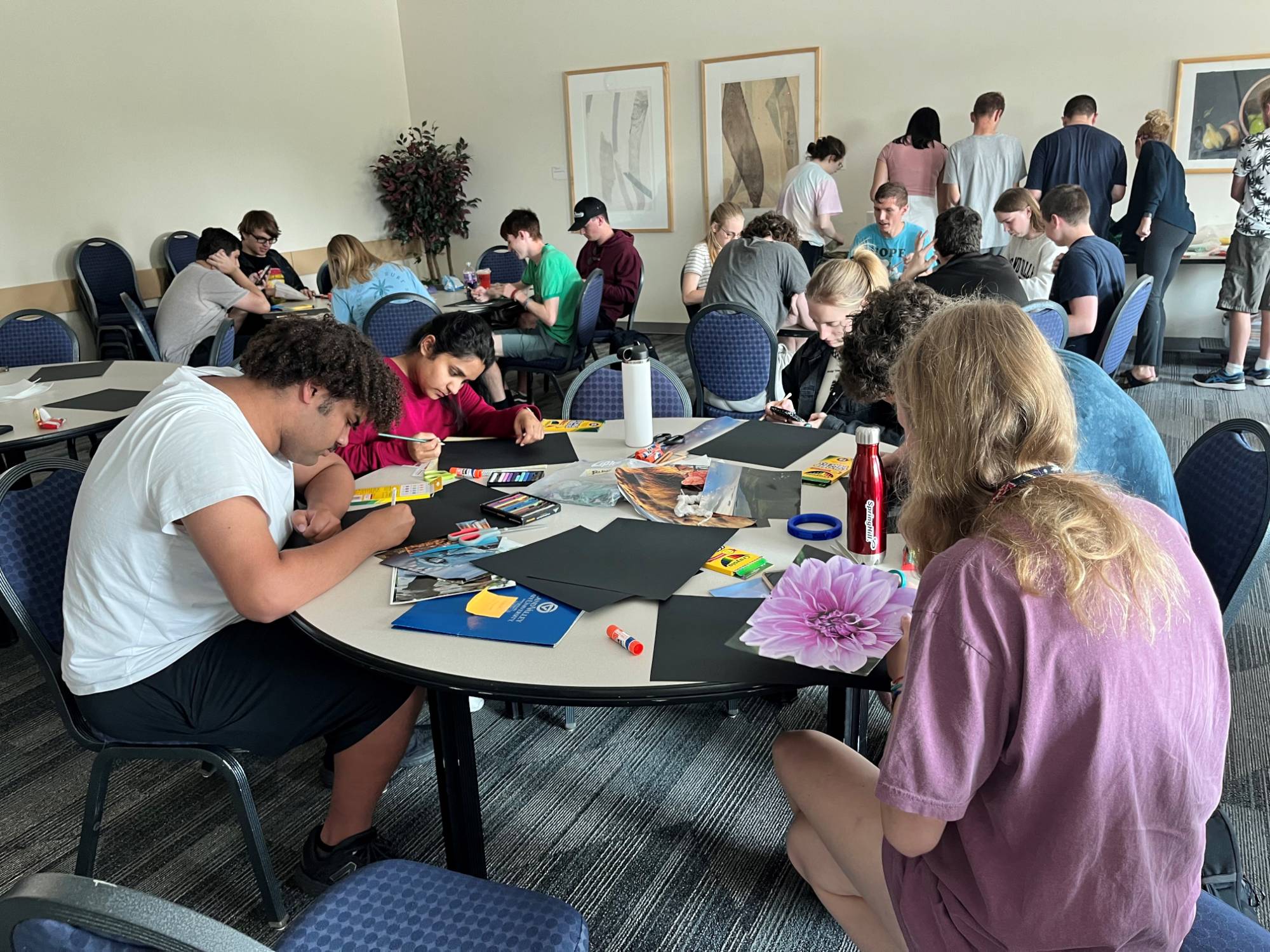 Group shot of links U participants creating personal collages